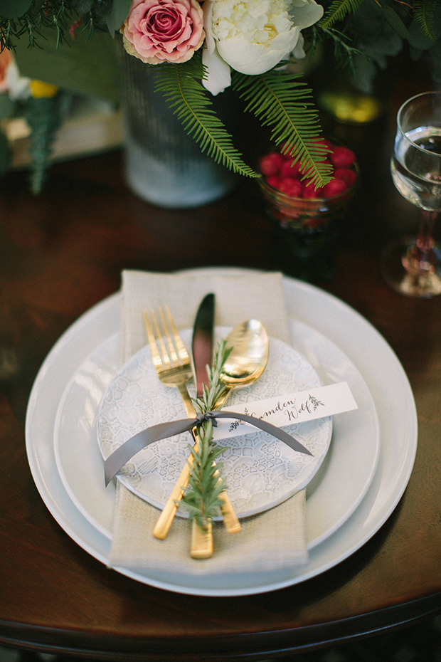 gold cutlery with thyme and ribbon