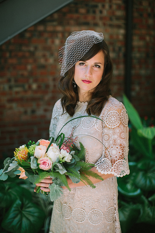 bride with lace BHLDN dress and birdcage