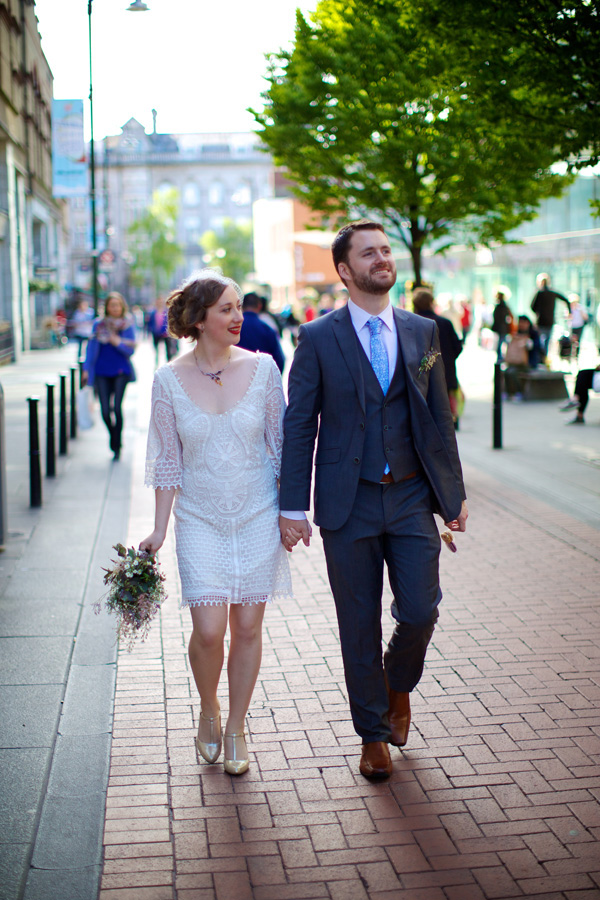 bride and groom walking in dublin city