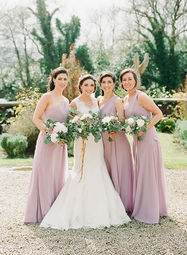 bridesmaids with dusty pink dresses