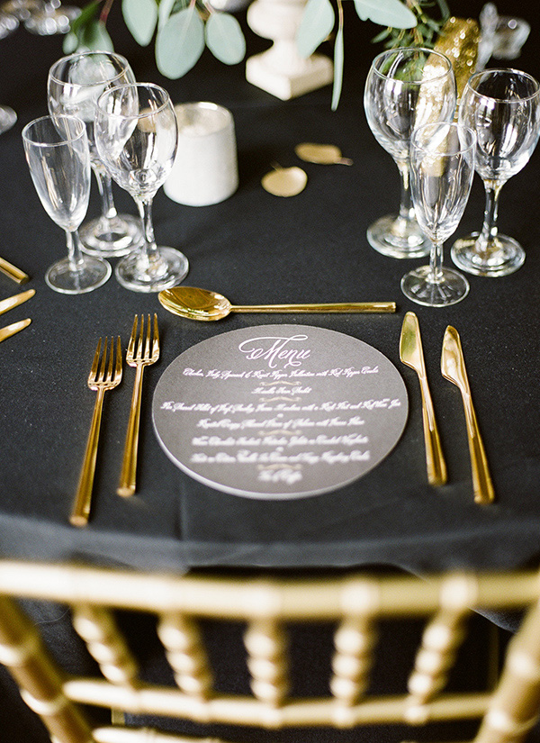 gold cutlery and round wedding stationery