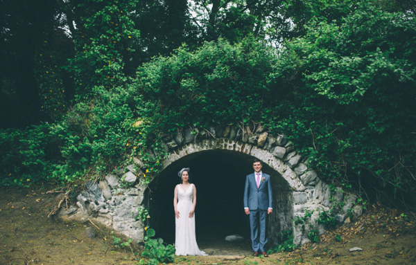 bride with lace dress and bircage veil