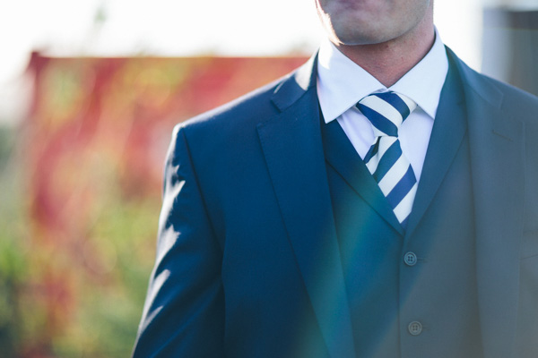 navy suit with stripey tie