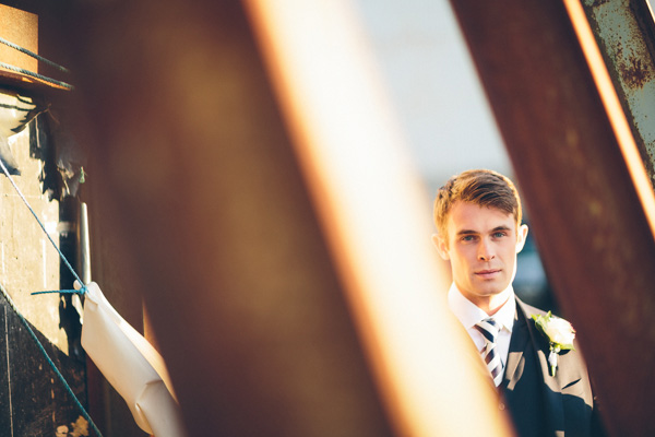 groom in a navy suit