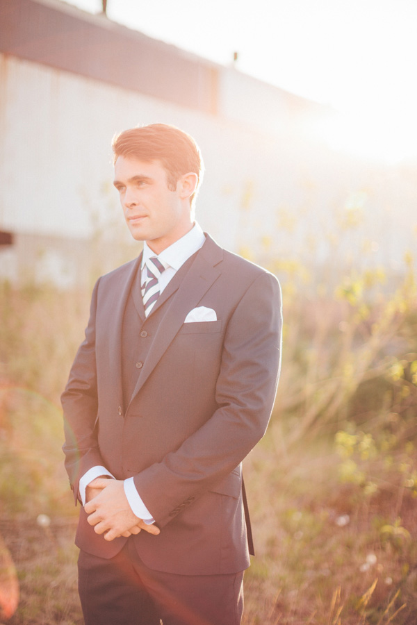 groom in a navy suit and stripey tie