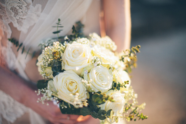 white rose, baby's breath and green bouquet