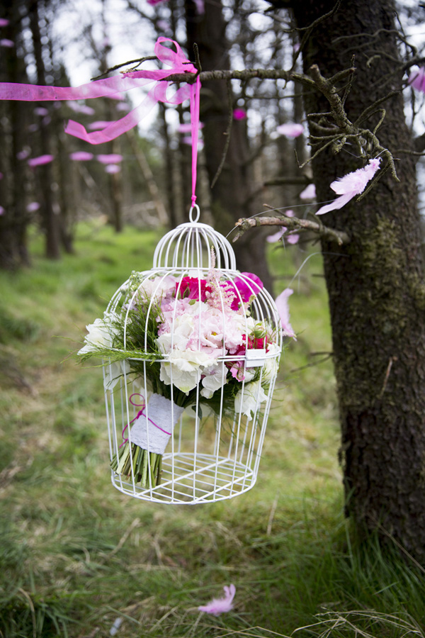 wire birdcage with flowers 