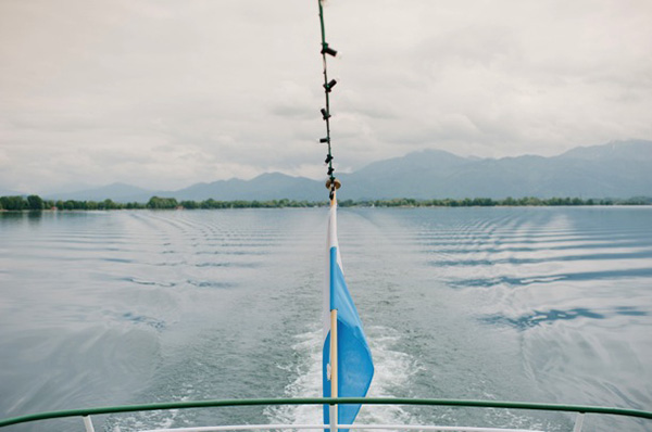 boat sailing away into the sea