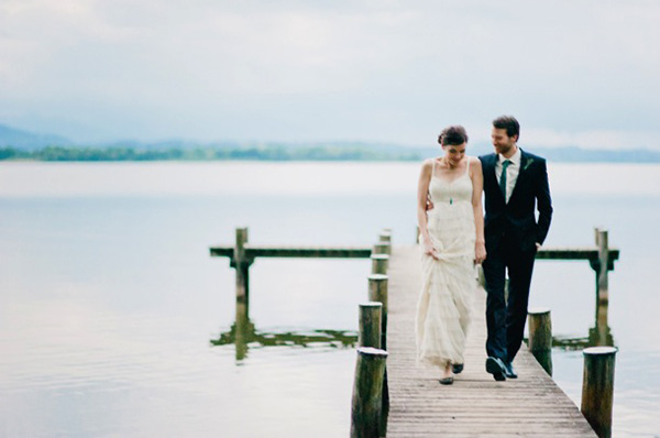 bride and groom photoshoot on a pier