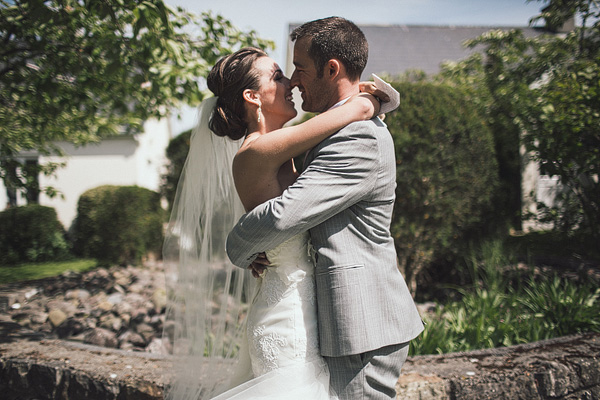 bride and groom first look embrace