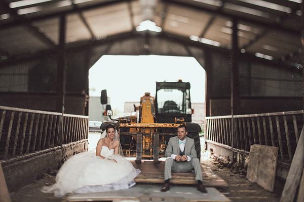 bride and groom portrait inside a barn