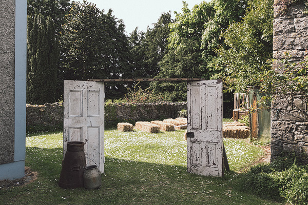 old wooden doors as an entrance to the outdoor ceremony