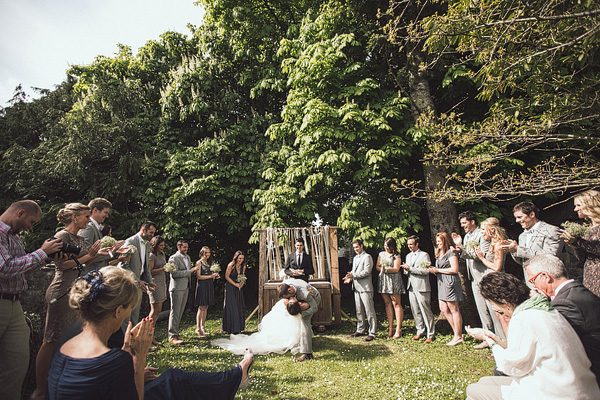 bride and groom embrace after ceremony