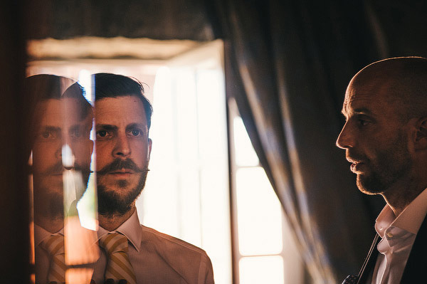 groom with mustache and stripey yellow tie