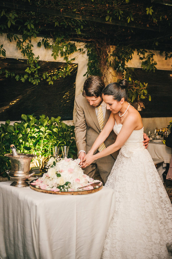 bride and groom cutting the cake