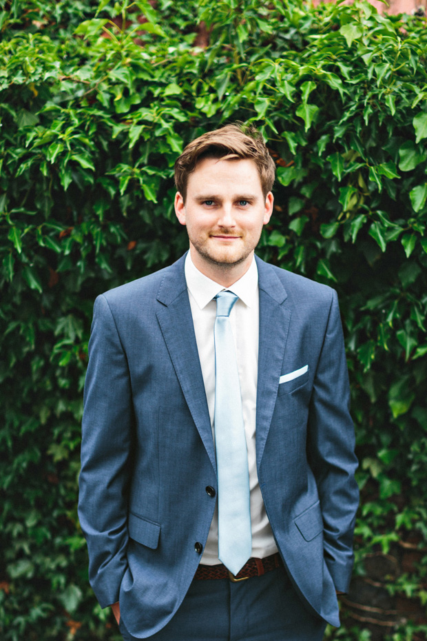 groom with blue suit and tie