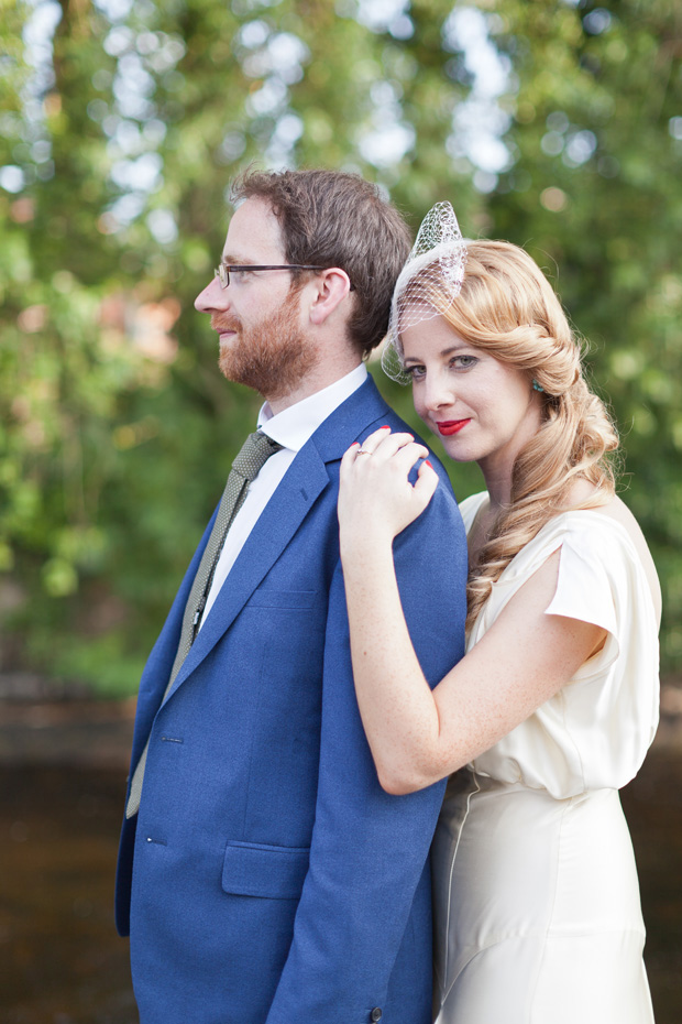 bride and groom with blue suit