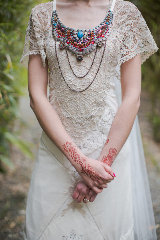 bride with henna tattoos and colourful jewellery