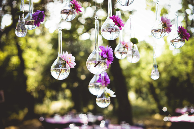 hanging glass vases with flowers