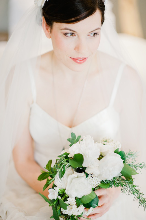 beautiful bride with understated wedding gown and long veil