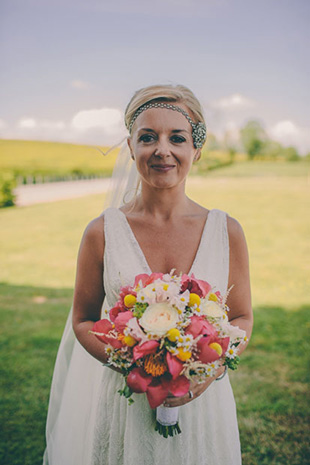 beautiful bride with pink and orange bouquet