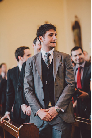 groom in a grey suit