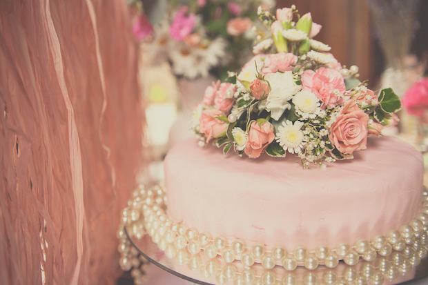 pink wedding cake with flower decor