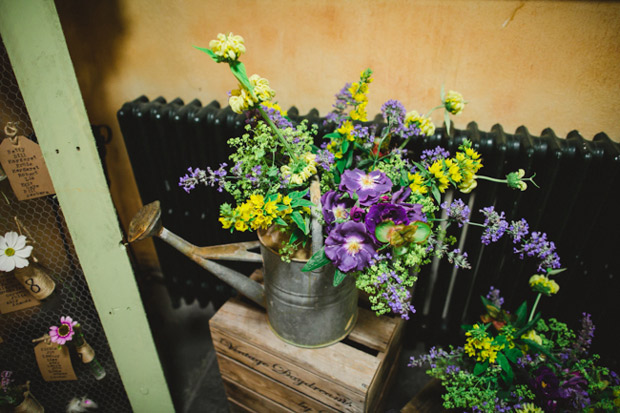 wild flowers in watering can