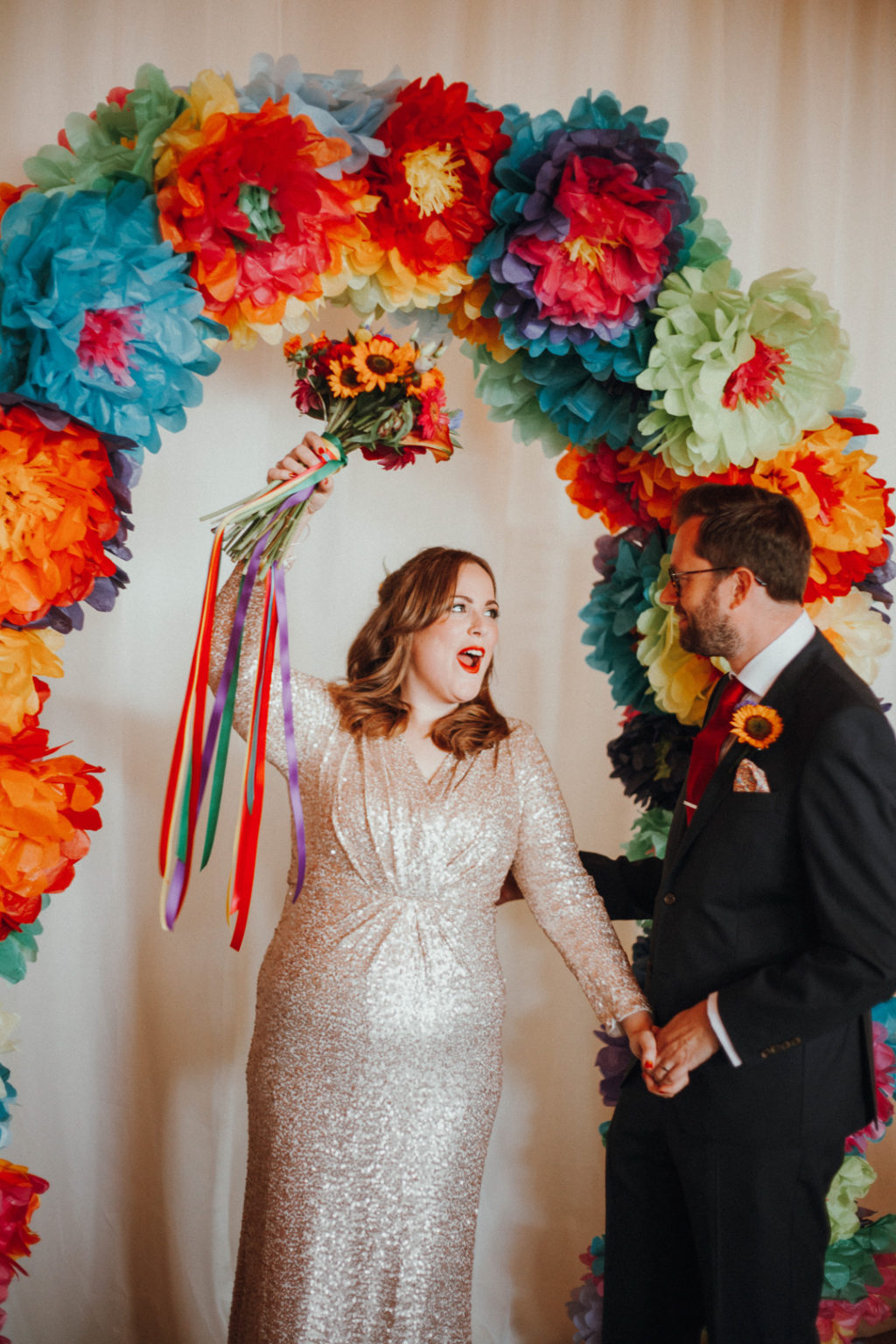 Colourful pompom wedding ceremony backdrop | One Fab Day