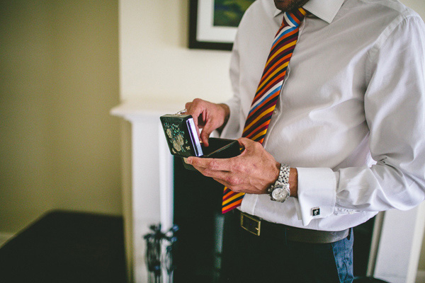 groom with colourful tie