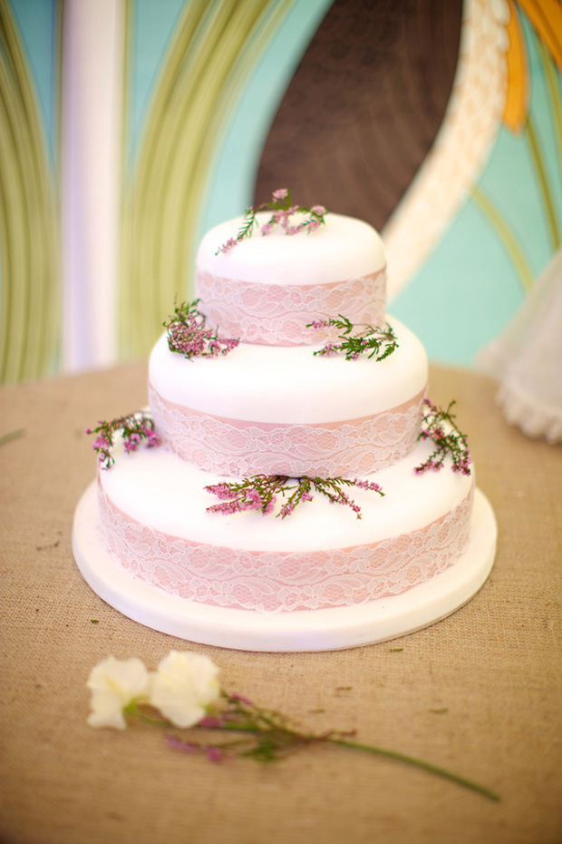 pink wedding cake with floral decor