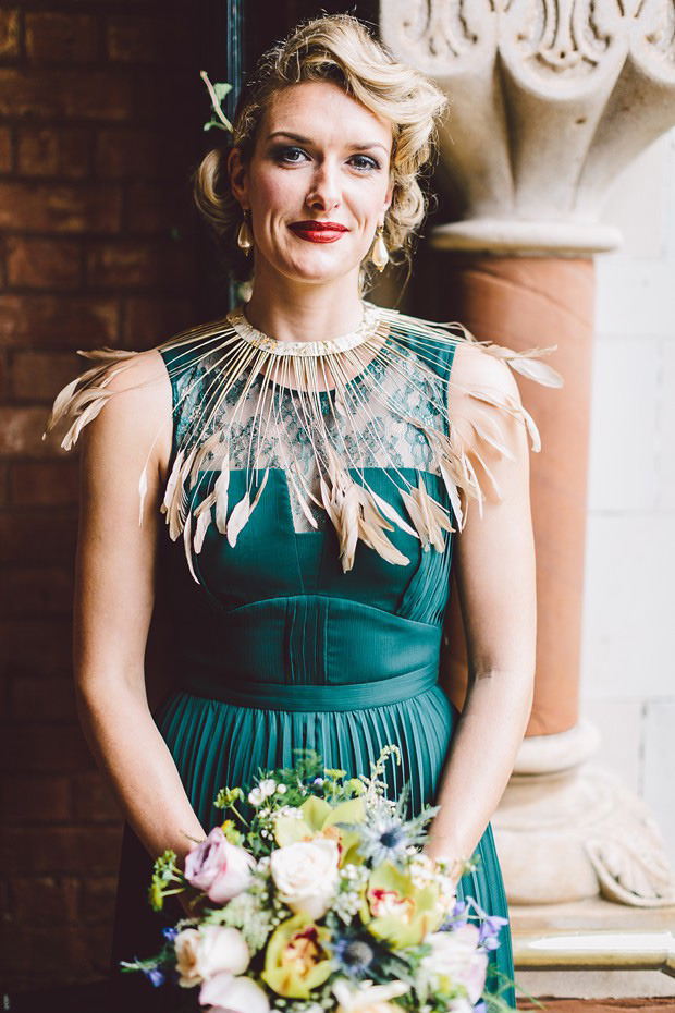 emerald green bridesmaid dress with feather collar detail