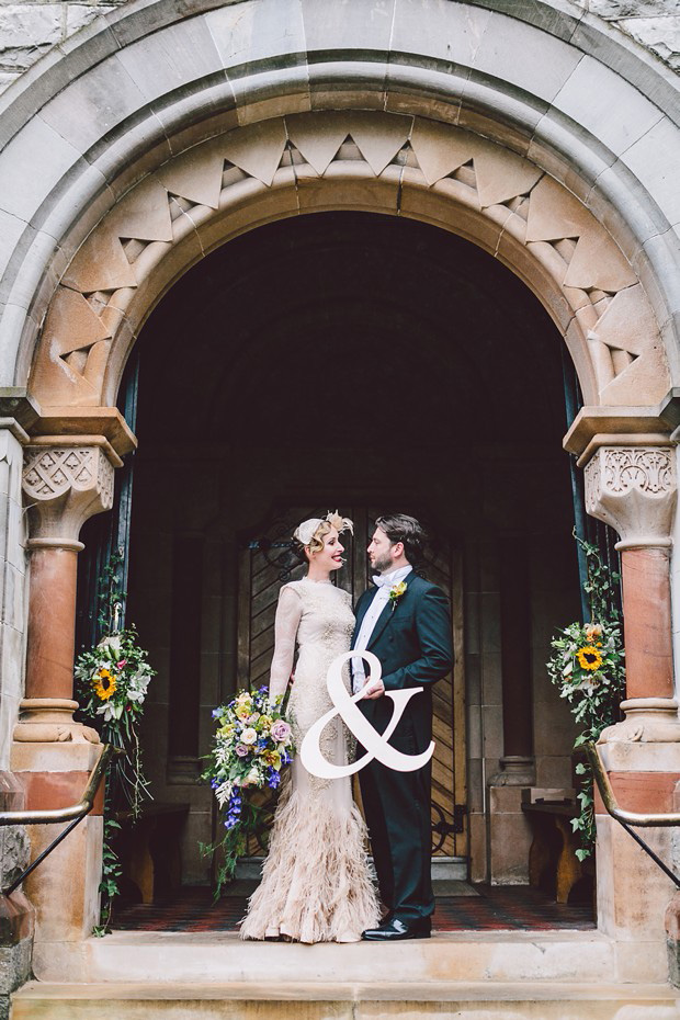 bride and groom with wedding sign