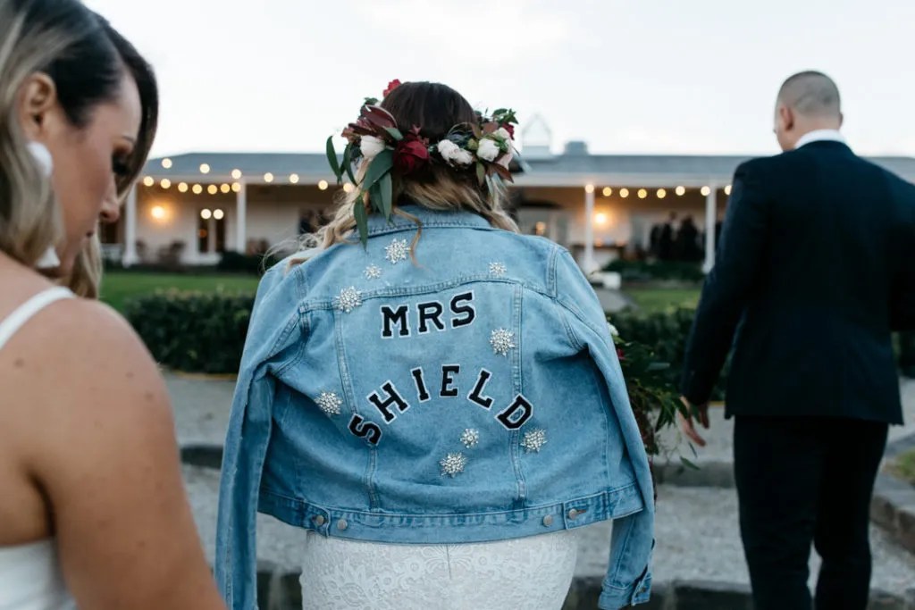 bride in denim jacket