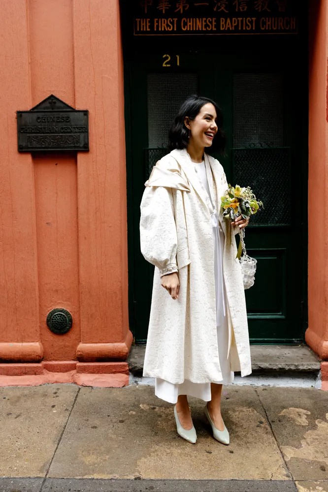 bride in Simone Rocha trench coat