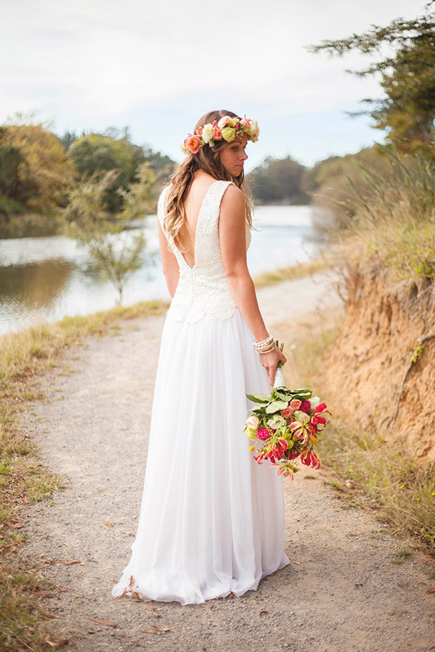 Stunning boho bride in custom wedding dress and floral crown | onefabday.com