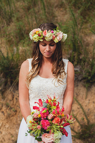 Stunning boho bride in custom wedding dress and floral crown | onefabday.com