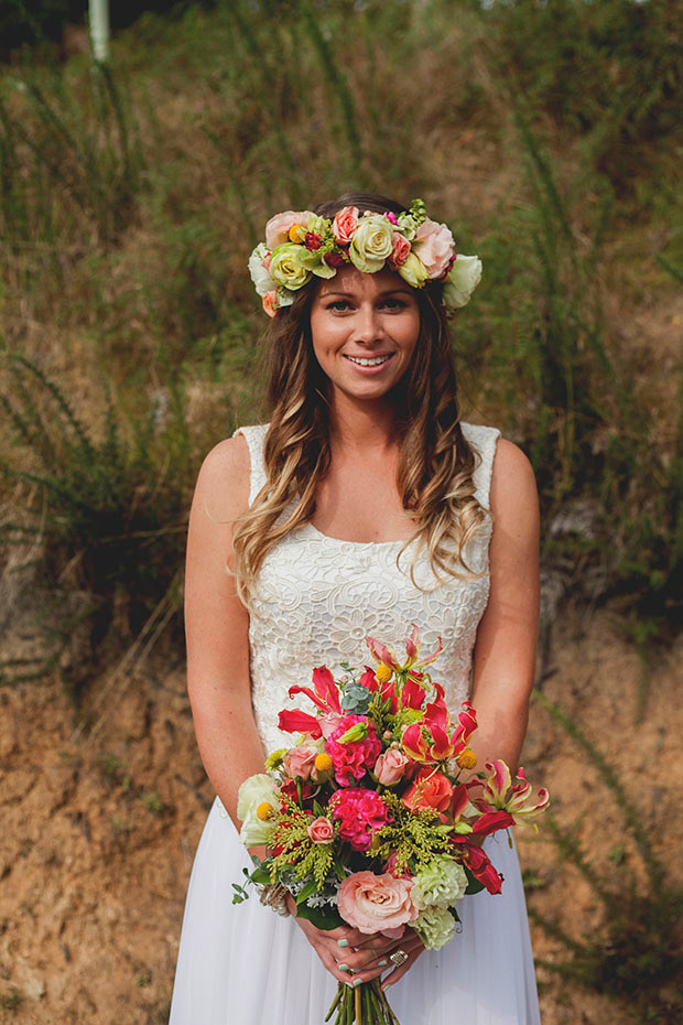 Stunning boho bride in custom wedding dress and floral crown | onefabday.com