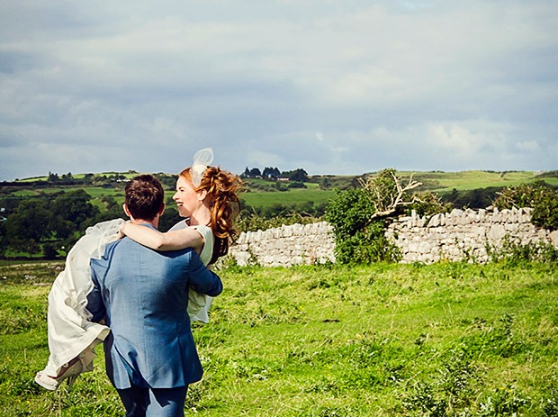 Groom carrying bride