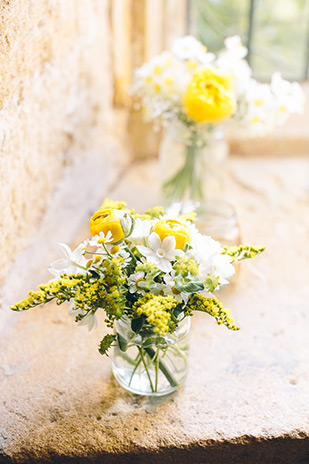 yellow and white blloms in glass jars | onefabday.com