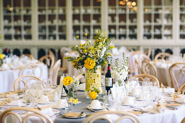 yellow and white blooms in glass jars with lemon slices | onefabday.com