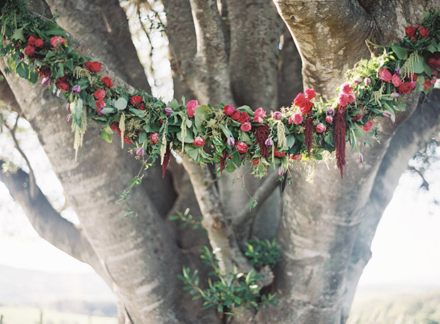 Red Floral Garland on a tree | onefabday.com