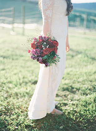 Lace wedding gown and red bouquet | onefabday.com