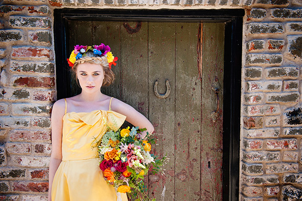 Orange, pink and yellow bridal bouquet | Contemporary yellow wedding dress | Photography by Fiona Jamieson | onefabday.com