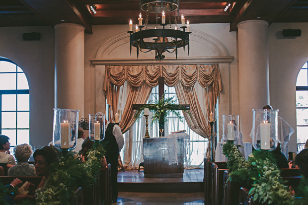 wedding ceremony with vintage pew ends, candles and foliage | onefabday.com