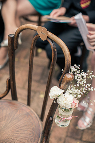 ceremony chair florals | Clare and Nathan's beautifully intimate wedding by I Heart Weddings | onefabday.com