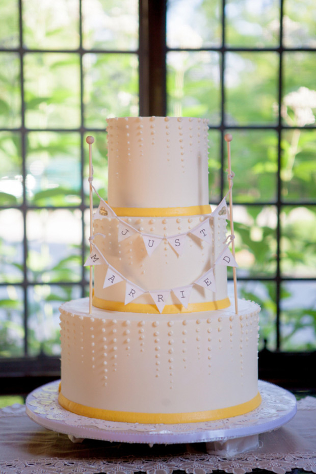 White wedding cake with yellow ribbon and Just Married bunting | onefabday.com