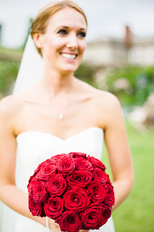  Red rose bridal bouquet | Alex and Lewis' beautiful red and white wedding by Butterfly Photography | onefabday.com