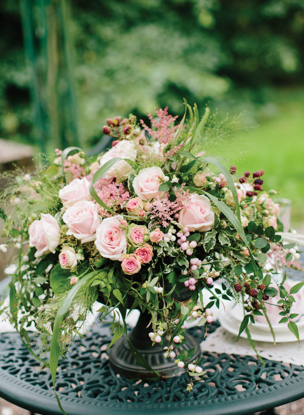 beautiful pink floral urn for a secret garden inspired wedding | onefabday.com