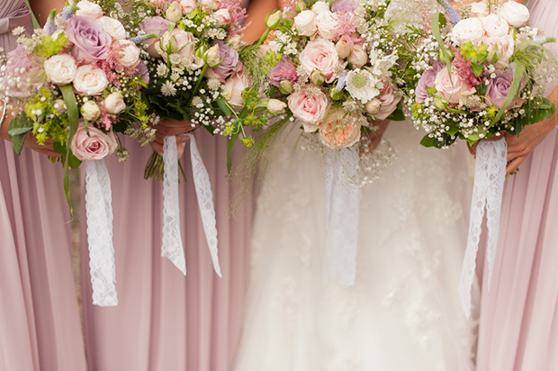 Pretty soft lilac bridesmaids bouquets and dresses | Paul and Ann's pretty barn wedding at Larchfield | onefabday.com